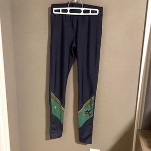 Notre Dame, Under Amour blue, green & gold athletic legging with ND logo on calf